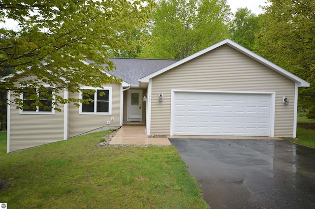 1433 Elk Run, Traverse City, MI 49696 - ranch-style house featuring asphalt driveway, a garage, a front yard, and roof with shingles
