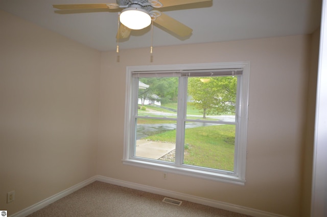 1433 Elk Run, Traverse City, MI 49696 - carpeted spare room with baseboards and a ceiling fan