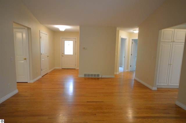 1433 Elk Run, Traverse City, MI 49696 - foyer featuring light wood-style flooring and baseboards