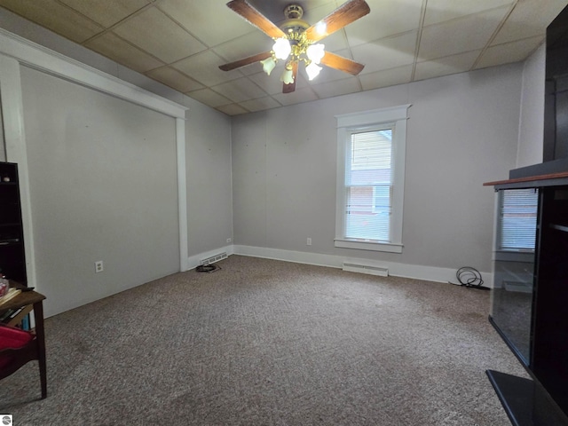 820 Wallace St, Cadillac, MI 49601 - unfurnished living room featuring ceiling fan, carpet flooring, and a drop ceiling