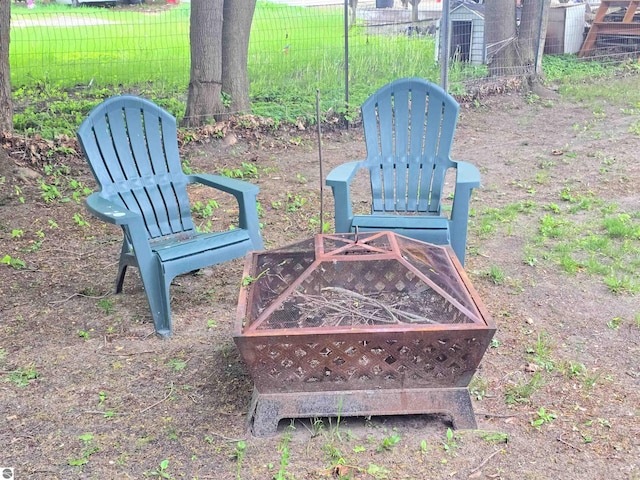 820 Wallace St, Cadillac, MI 49601 - view of yard with an outdoor fire pit