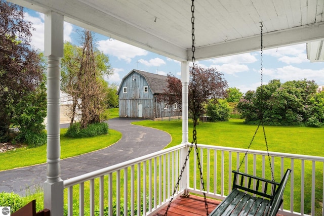 9889 Ramsay Rd, Buckley, MI 49620 - porch featuring a barn, a yard, and an outdoor structure