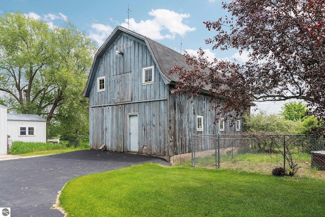 9889 Ramsay Rd, Buckley, MI 49620 - view of barn featuring asphalt driveway