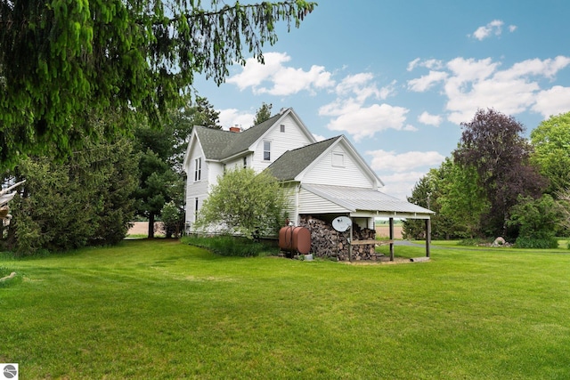 9889 Ramsay Rd, Buckley, MI 49620 - back of property with a yard and roof with shingles