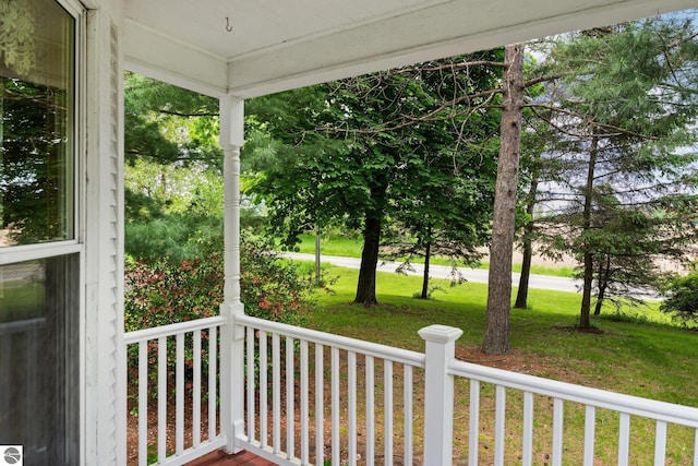 9889 Ramsay Rd, Buckley, MI 49620 - wooden porch with a lawn