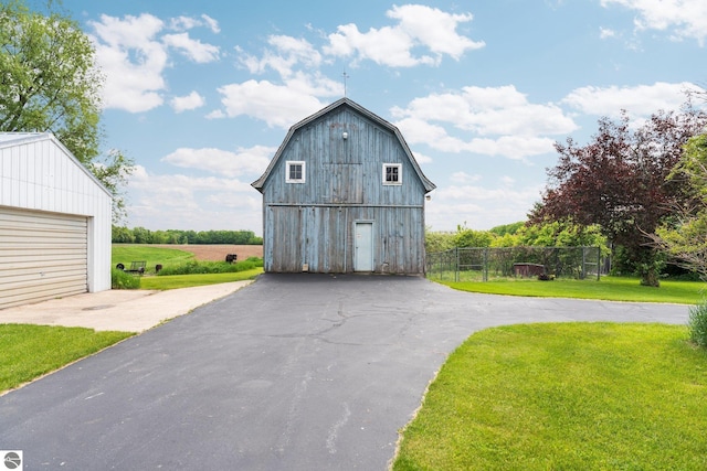 9889 Ramsay Rd, Buckley, MI 49620 - view of barn featuring driveway