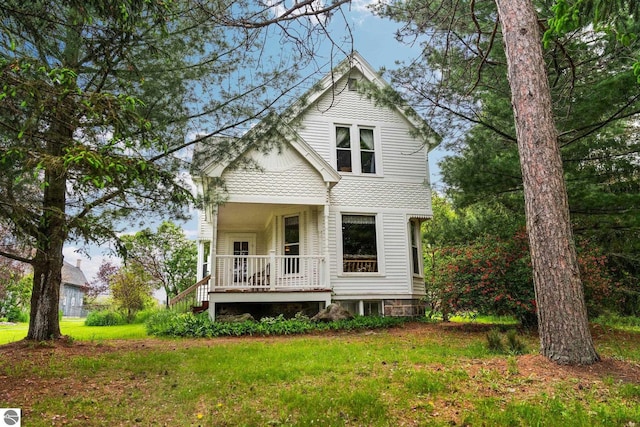 9889 Ramsay Rd, Buckley, MI 49620 - view of front of house with covered porch and a front yard