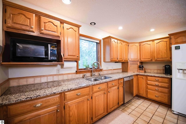 10226 Deerpath N, Traverse City, MI 49685 - kitchen featuring dishwasher, black microwave, white refrigerator with ice dispenser, a sink, and recessed lighting