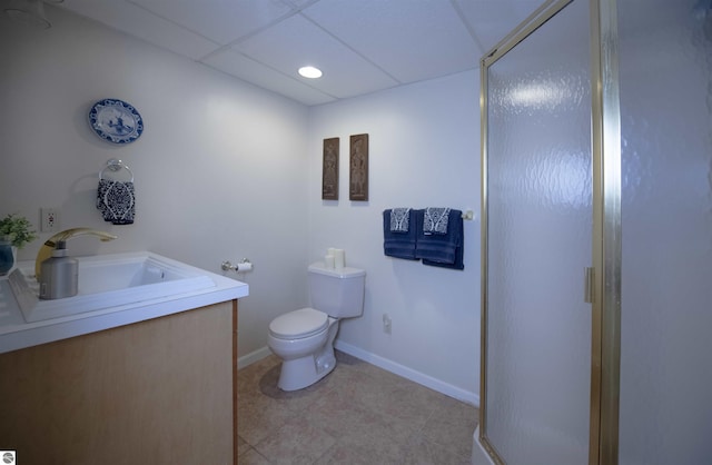 10226 Deerpath N, Traverse City, MI 49685 - full bathroom with a shower stall, toilet, vanity, a drop ceiling, and baseboards
