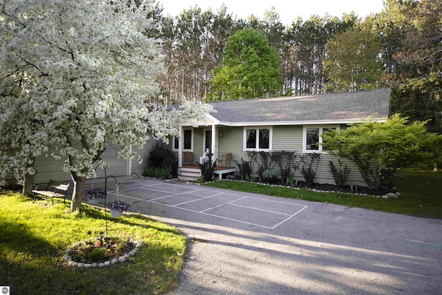 10226 Deerpath N, Traverse City, MI 49685 - ranch-style house featuring a garage
