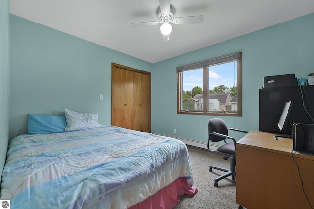 217 Winona Pl, Cadillac, MI 49601 - carpeted bedroom with a desk, a ceiling fan, a closet, and baseboards