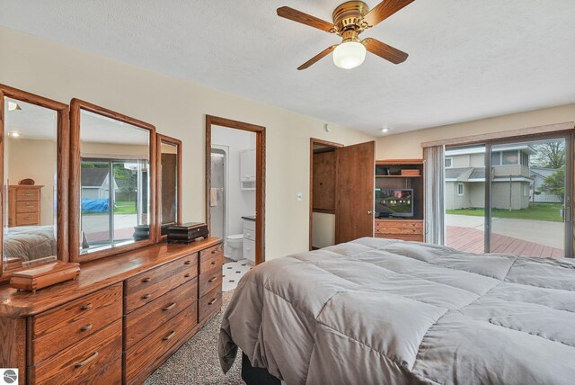 217 Winona Pl, Cadillac, MI 49601 - carpeted bedroom featuring access to exterior and ensuite bath