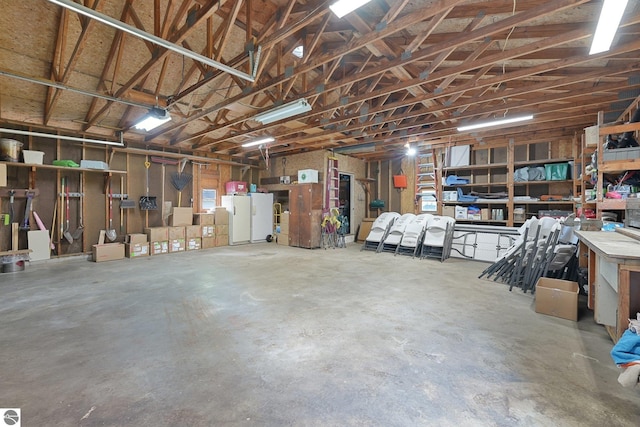 217 Winona Pl, Cadillac, MI 49601 - garage featuring a workshop area