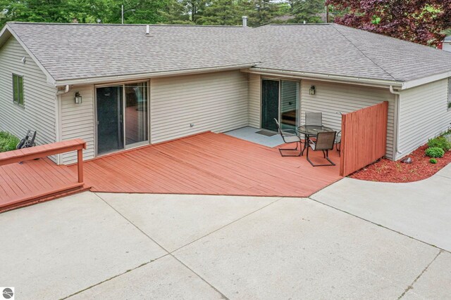 217 Winona Pl, Cadillac, MI 49601 - wooden deck with a patio area