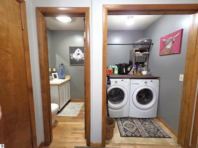 902 S Crapo St, Mount Pleasant, MI 48858 - laundry room featuring independent washer and dryer, wood finished floors, baseboards, and a sink