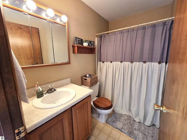 902 S Crapo St, Mount Pleasant, MI 48858 - bathroom featuring toilet, vanity, tile patterned flooring, and curtained shower