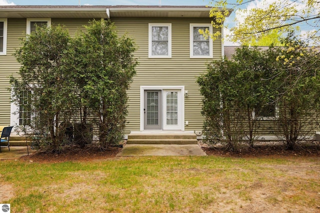1491 Kent St Unit 9, Traverse City, MI 49686 - back of house featuring a yard