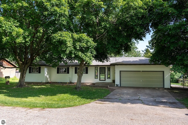 3145 S Concourse Dr, Mount Pleasant, MI 48858 - ranch-style house with asphalt driveway and a garage