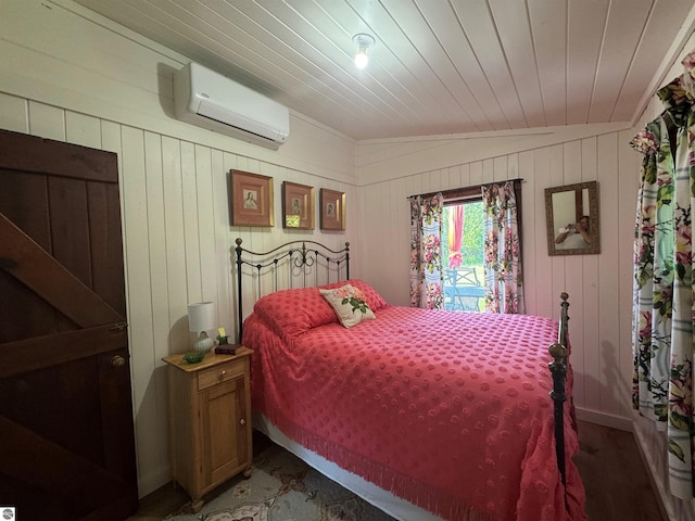 8489 S Glen Lake Rd, Glen Arbor, MI 49636 - bedroom with a wall mounted AC, wood ceiling, and wooden walls