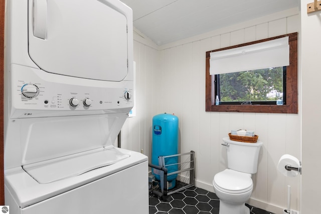 8489 S Glen Lake Rd, Glen Arbor, MI 49636 - washroom with stacked washing machine and dryer and tile patterned floors