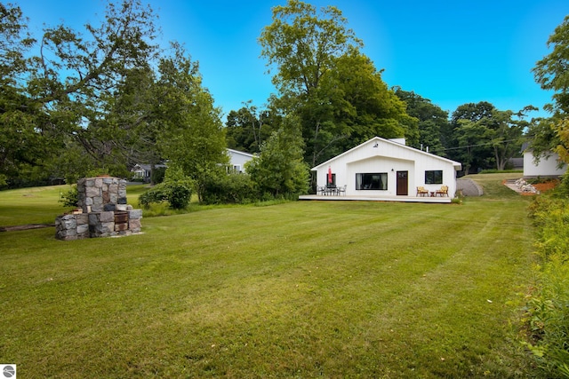 8489 S Glen Lake Rd, Glen Arbor, MI 49636 - view of grassy yard with a wooden deck