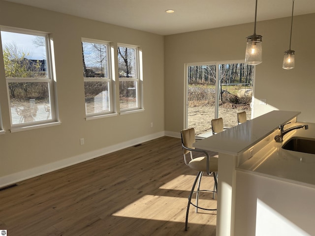7559 E Meadows Dr Unit 52, Traverse City, MI 49621 - dining area featuring wood finished floors, recessed lighting, and baseboards