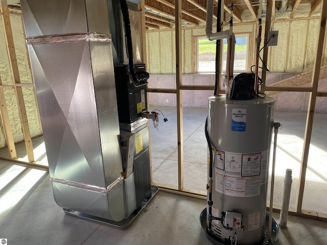 7559 E Meadows Dr Unit 52, Traverse City, MI 49621 - utility room featuring gas water heater and heating unit