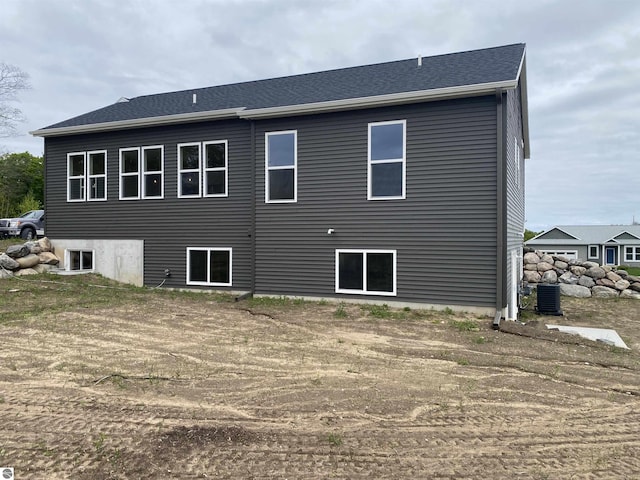 7559 E Meadows Dr Unit 52, Traverse City, MI 49621 - back of property featuring central air condition unit
