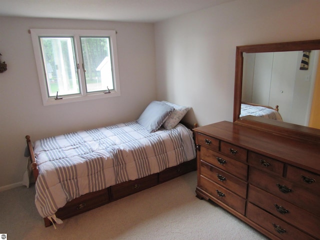 2011 Douglas Dr, Tawas City, MI 48763 - bedroom featuring light colored carpet