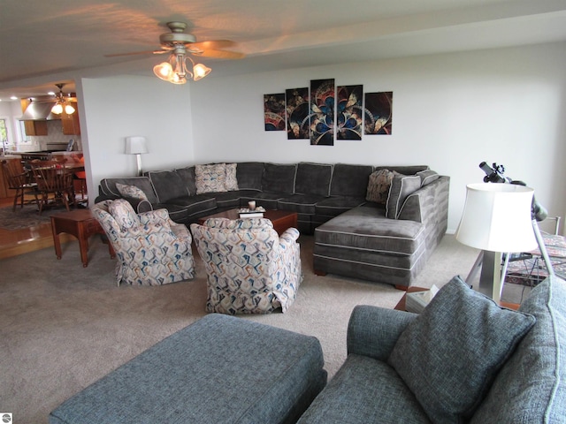 2011 Douglas Dr, Tawas City, MI 48763 - living area with ceiling fan and carpet flooring