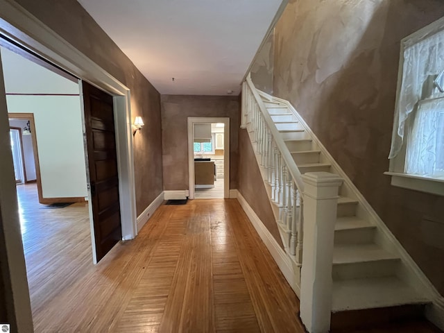 506 E Division St, Cadillac, MI 49601 - staircase with wood finished floors and baseboards