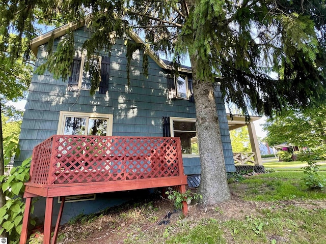 506 E Division St, Cadillac, MI 49601 - back of house featuring a wooden deck