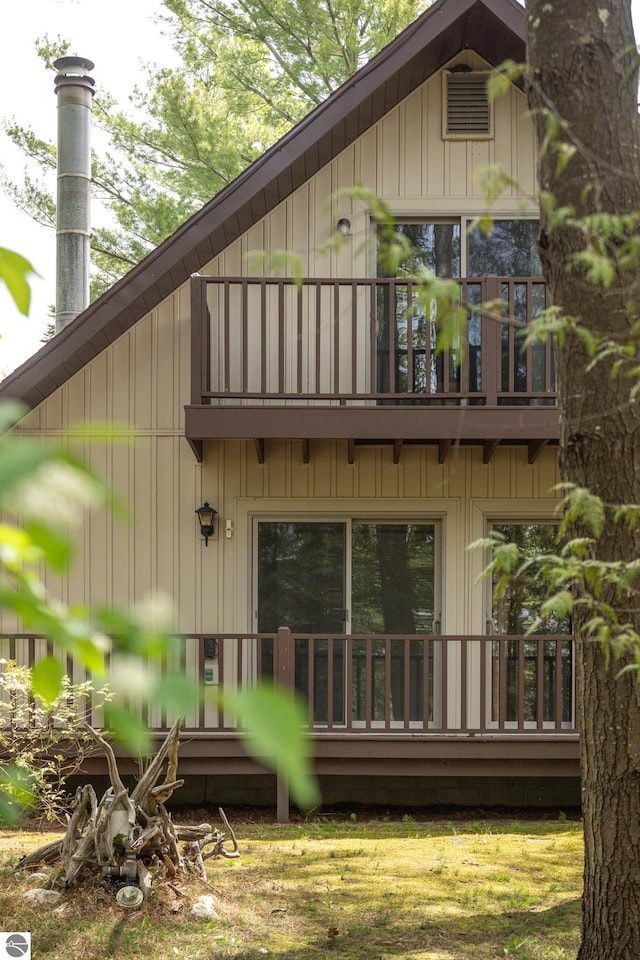 3228 S Skeba Rd S, Lake Leelanau, MI 49653 - rear view of property with a balcony