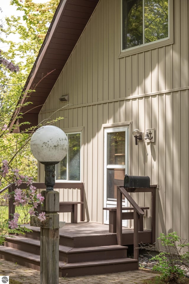 3228 S Skeba Rd S, Lake Leelanau, MI 49653 - property entrance with board and batten siding