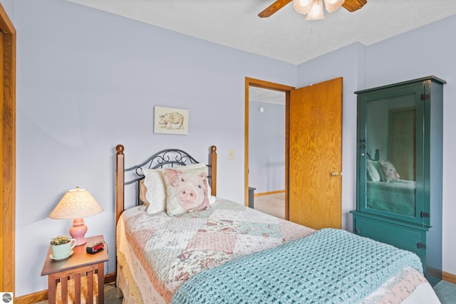 11103 S Ramblewood Dr, Cedar, MI 49621 - carpeted bedroom featuring baseboards and a ceiling fan