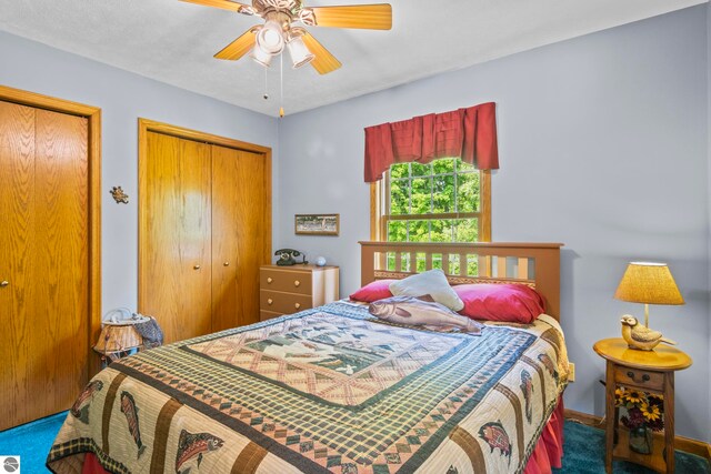 11103 S Ramblewood Dr, Cedar, MI 49621 - bedroom featuring carpet flooring and a ceiling fan