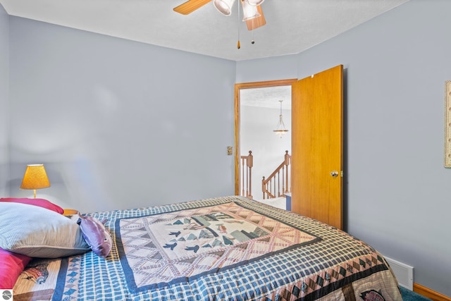 11103 S Ramblewood Dr, Cedar, MI 49621 - carpeted bedroom featuring a ceiling fan
