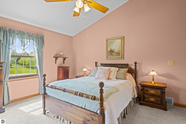 11103 S Ramblewood Dr, Cedar, MI 49621 - bedroom with carpet floors, lofted ceiling, baseboards, and ceiling fan