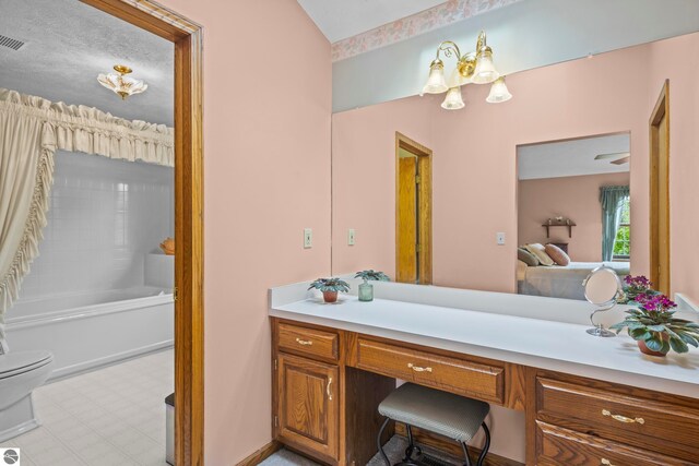 11103 S Ramblewood Dr, Cedar, MI 49621 - full bathroom with vanity, toilet, and tile patterned floors