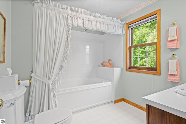 11103 S Ramblewood Dr, Cedar, MI 49621 - bathroom featuring toilet, tile patterned floors, vanity, baseboards, and shower / bath combination with curtain