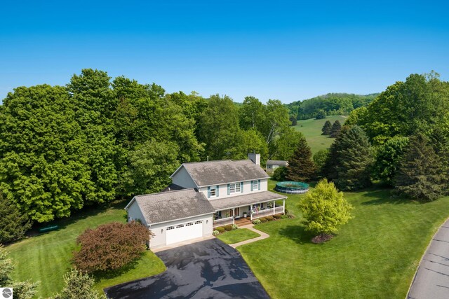 11103 S Ramblewood Dr, Cedar, MI 49621 - view from above of property featuring a heavily wooded area