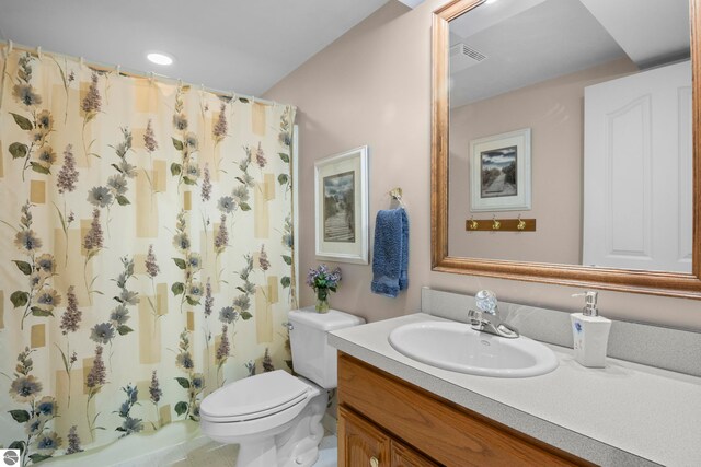 11103 S Ramblewood Dr, Cedar, MI 49621 - bathroom featuring vanity, toilet, and curtained shower