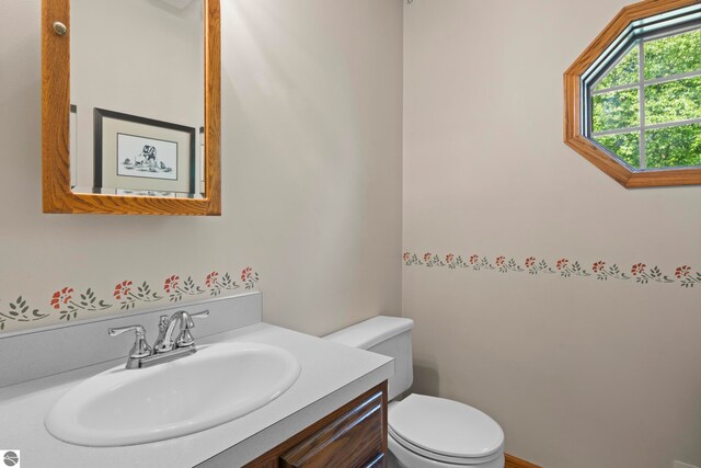 11103 S Ramblewood Dr, Cedar, MI 49621 - half bath featuring toilet and vanity