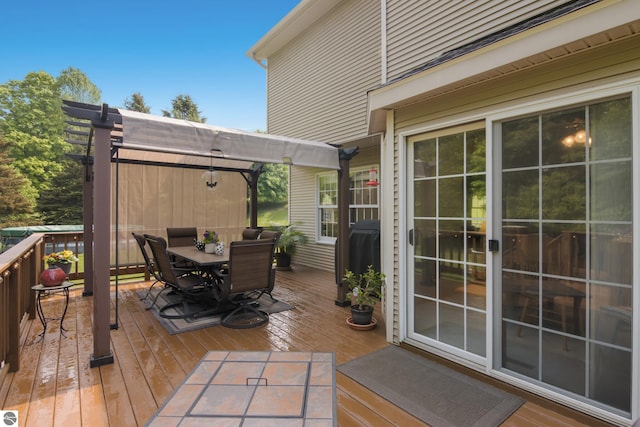 11103 S Ramblewood Dr, Cedar, MI 49621 - wooden deck with outdoor dining space and a pergola
