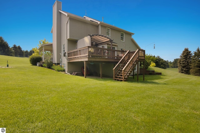 11103 S Ramblewood Dr, Cedar, MI 49621 - back of house featuring a deck, stairs, a chimney, and a lawn