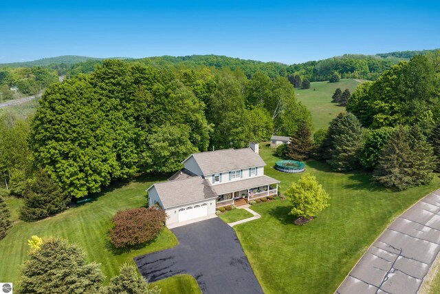 11103 S Ramblewood Dr, Cedar, MI 49621 - view of subject property with a forest