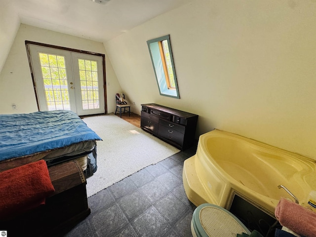 11711 E 22 3/4 Rd, Manton, MI 49663 - bedroom featuring french doors, access to outside, and vaulted ceiling