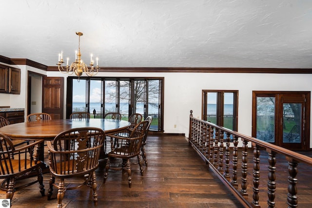 12150 N Seven Pines Rd, Northport, MI 49670 - dining space featuring a chandelier, wood-type flooring, and crown molding