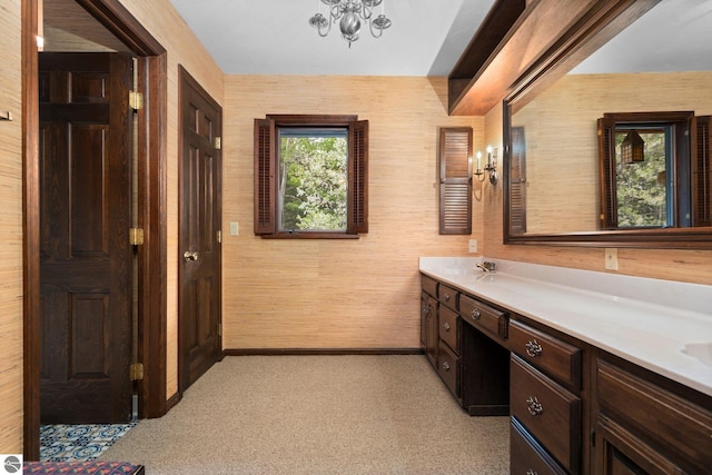12150 N Seven Pines Rd, Northport, MI 49670 - bathroom featuring vanity, a chandelier, and carpet floors
