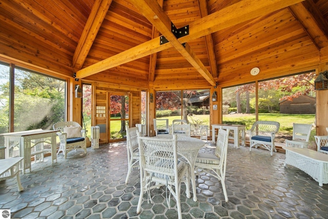 12150 N Seven Pines Rd, Northport, MI 49670 - sunroom with healthy amount of natural light and outdoor dining area